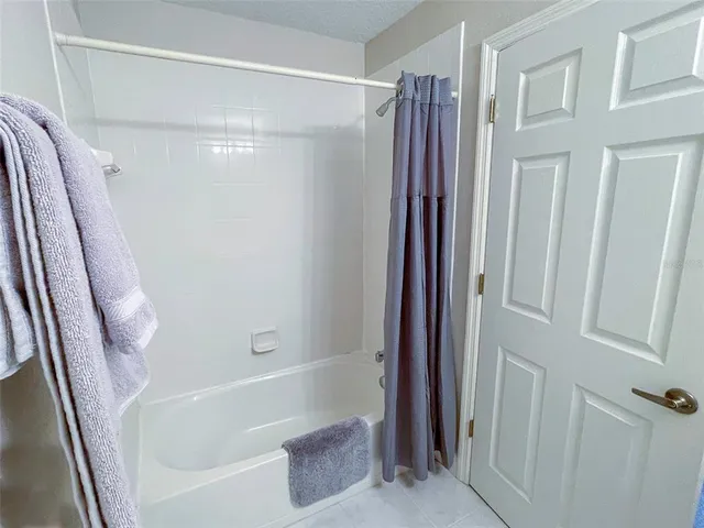 a view of storage and utility room with washer and dryer