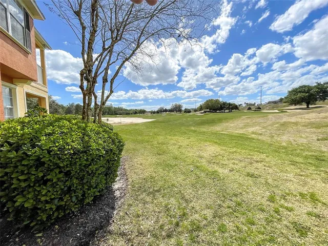 a view of a yard with a house
