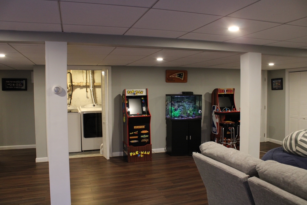 225 Braemoor Road Brockton, MA 02301 - Photo 27 of 29 a living room with furniture and a flat screen tv