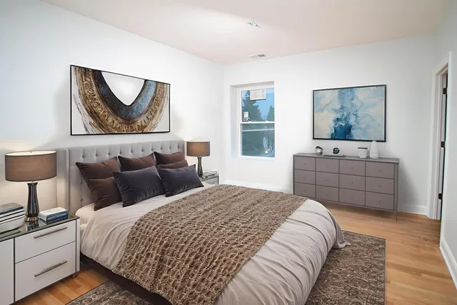 a bedroom with bed and window