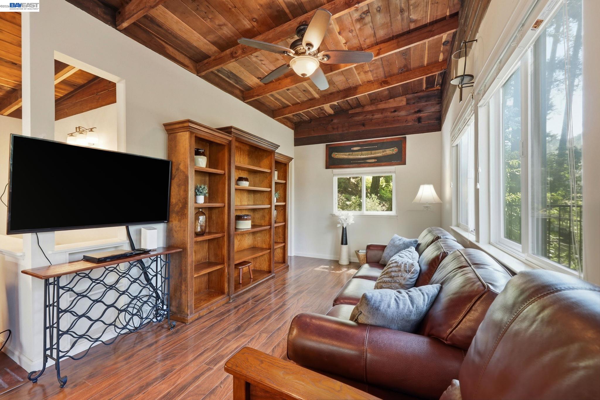 11700 Oak Road Forestville, CA 95436 - Photo 7 of 20 a living room with furniture a flat screen tv and a window