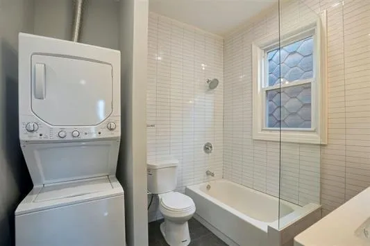 a bathroom with a toilet and a bathtub