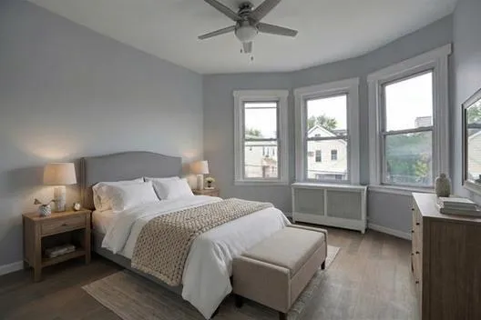 a bedroom with a bed and window