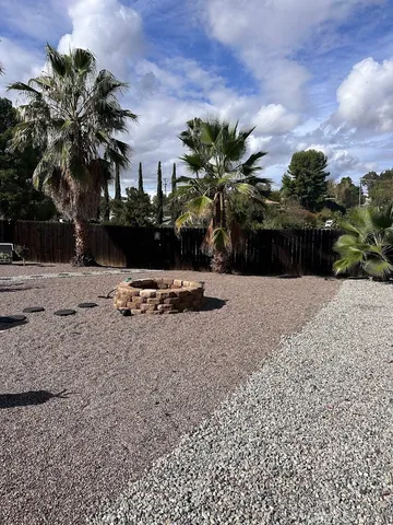 a view of swimming pool with a yard