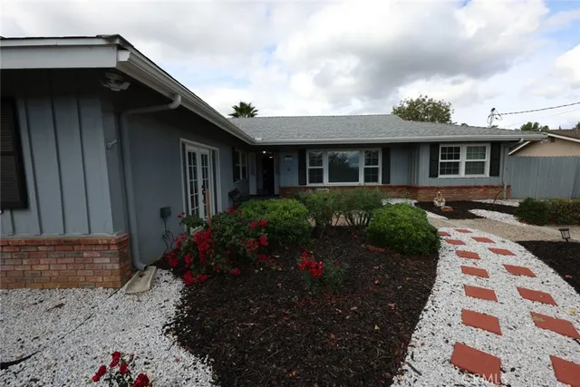 a house view with a garden space
