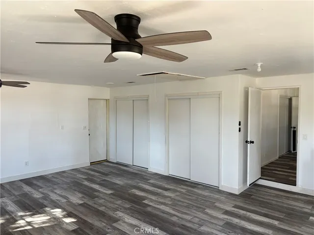 a view of a livingroom with wooden floor
