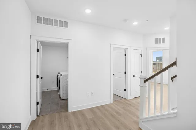 a bathroom with a sink mirror and toilet