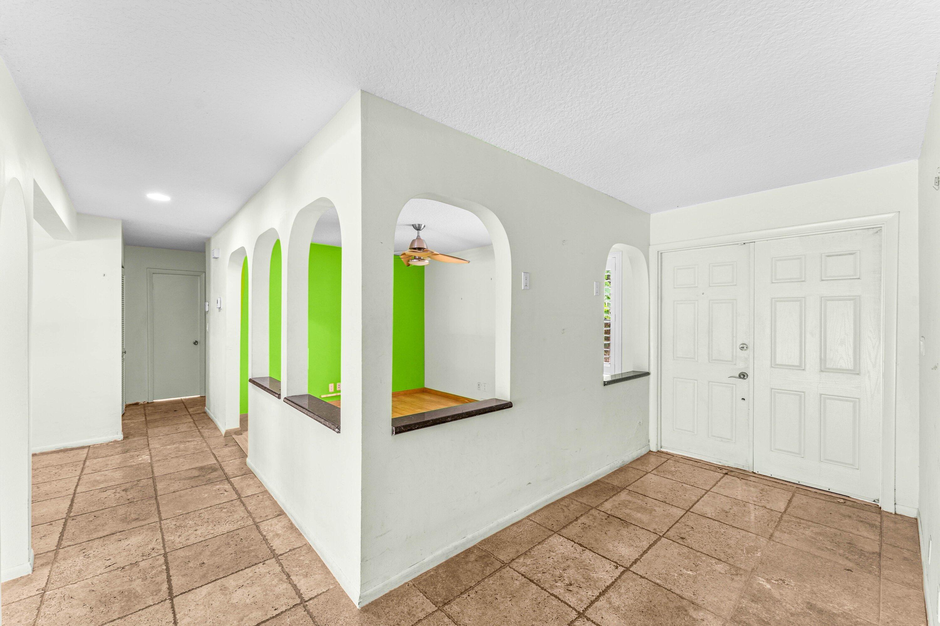 2753 Northwest 34th Street Boca Raton, FL 33434 - Photo 5 of 41 a view of hallway with furniture and a window
