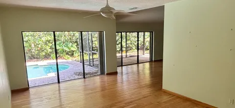 a view of an empty room with glass door