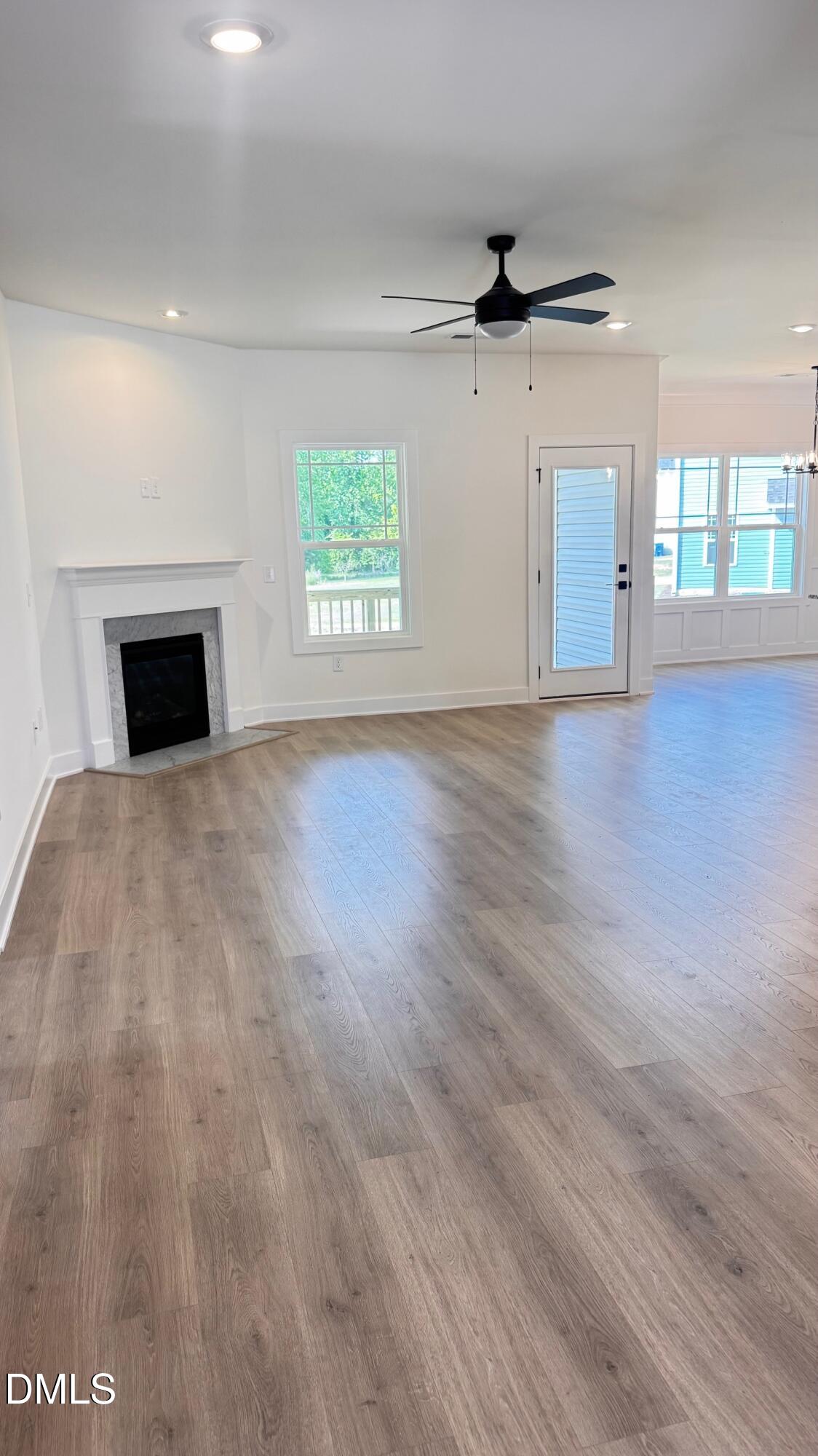 20 Streamline Court Lillington, NC 27546 - Photo 10 of 46 an empty room with windows and ceiling fan