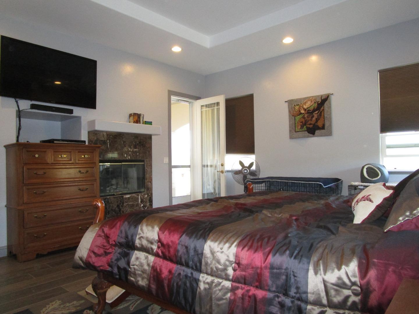 1320 Spring Grove Road Hollister, CA 95023 - Photo 11 of 51 a bedroom with a bed and a television