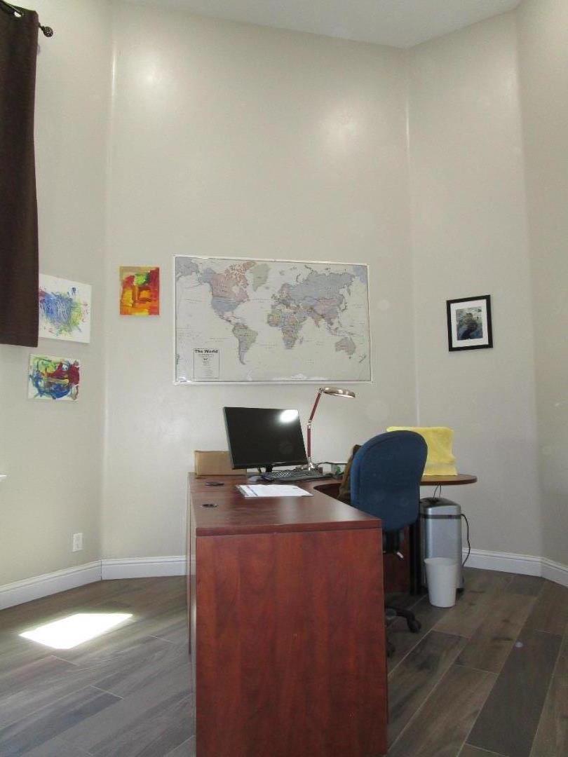 1320 Spring Grove Road Hollister, CA 95023 - Photo 22 of 51 a workspace with furniture and wooden floor