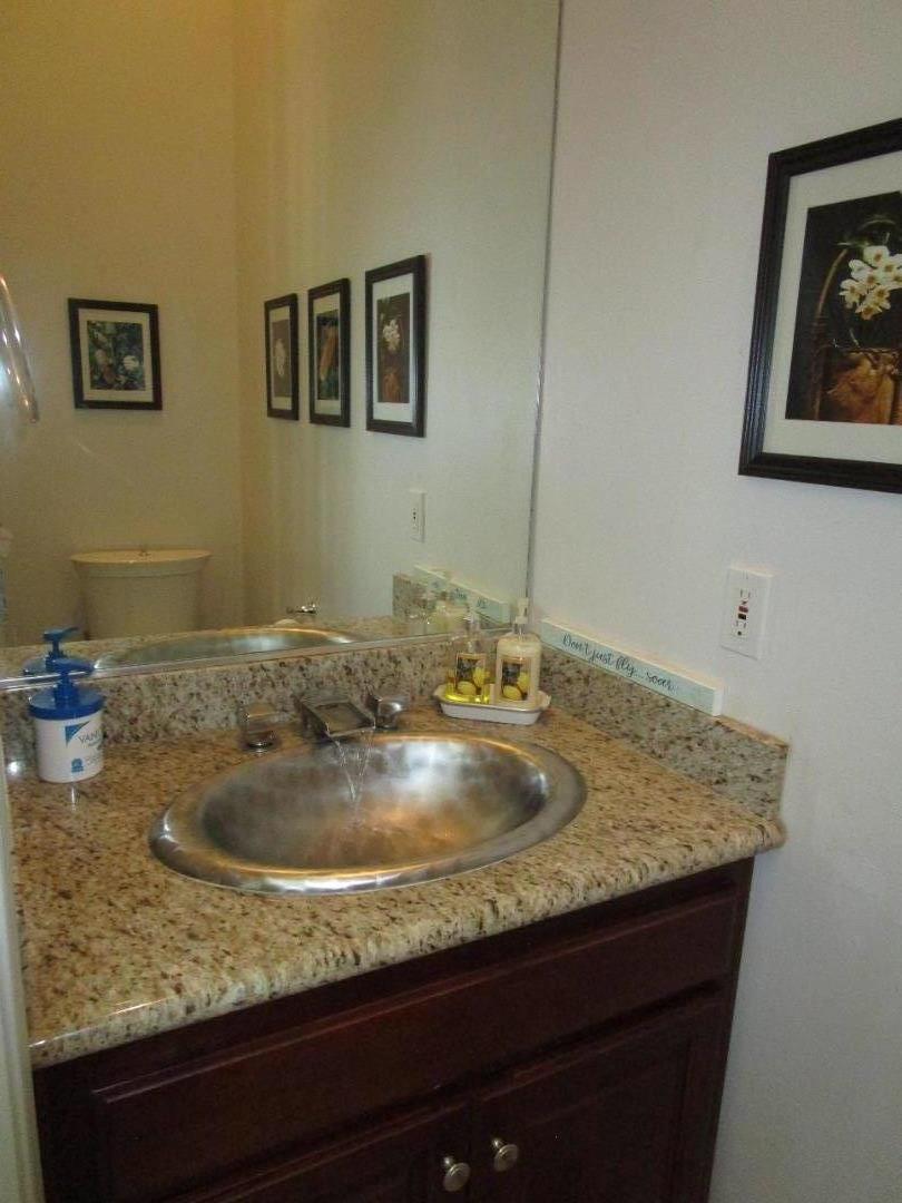 1320 Spring Grove Road Hollister, CA 95023 - Photo 25 of 51 a bathroom with sinks granite and a sink