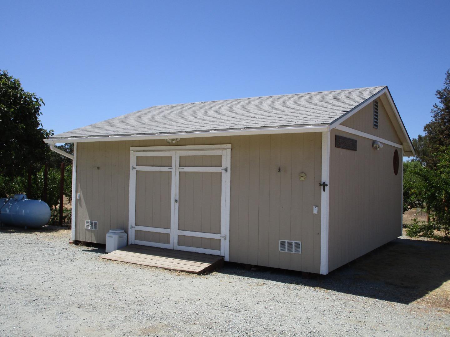 1320 Spring Grove Road Hollister, CA 95023 - Photo 40 of 51 a view of a house with a barbeque and wooden fence