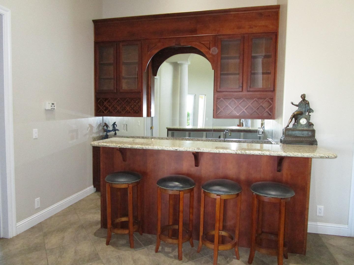 1320 Spring Grove Road Hollister, CA 95023 - Photo 9 of 51 a kitchen with a dining table and chairs