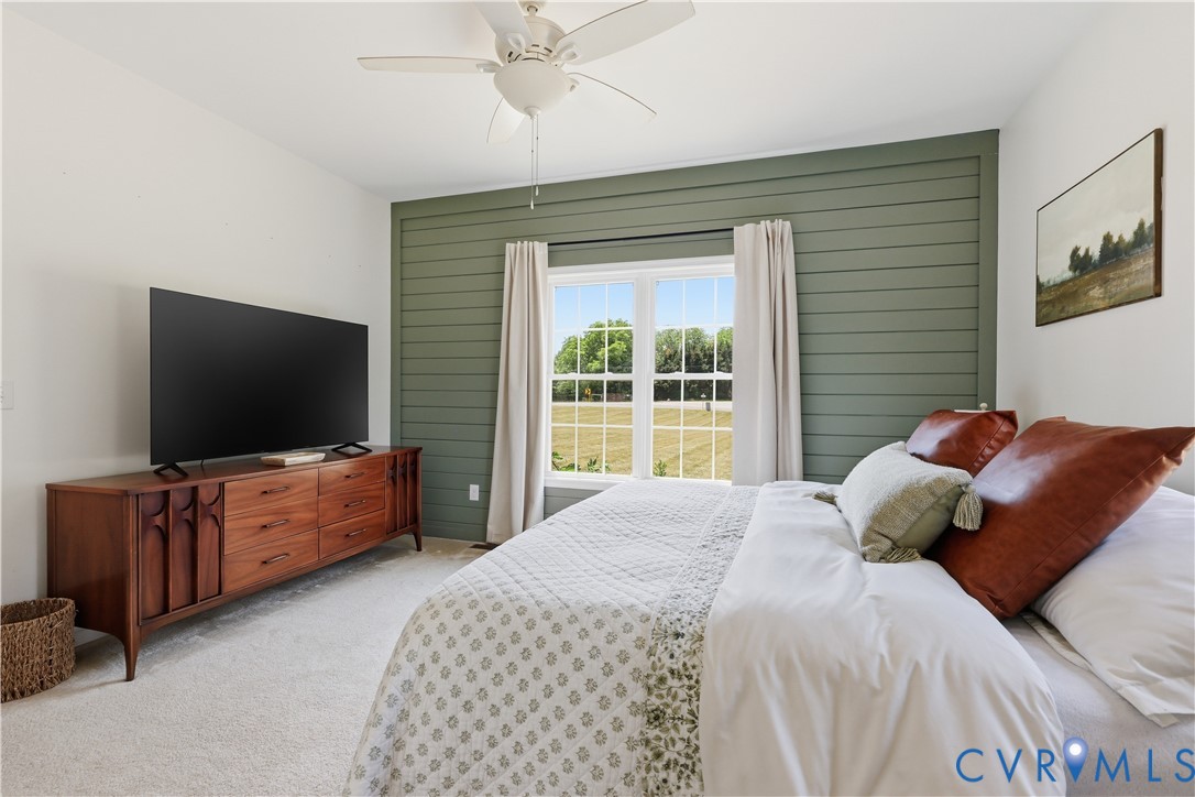 235 Stoney Point Road Cumberland, VA 23040 - Photo 26 of 35 a bedroom with a large bed and a flat screen tv