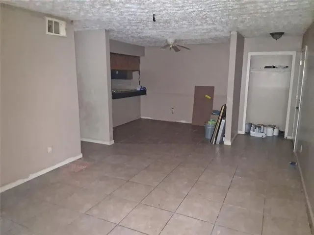 a view of a storage & utility room with a sink