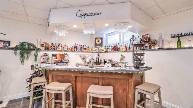a kitchen with a table and chairs in it