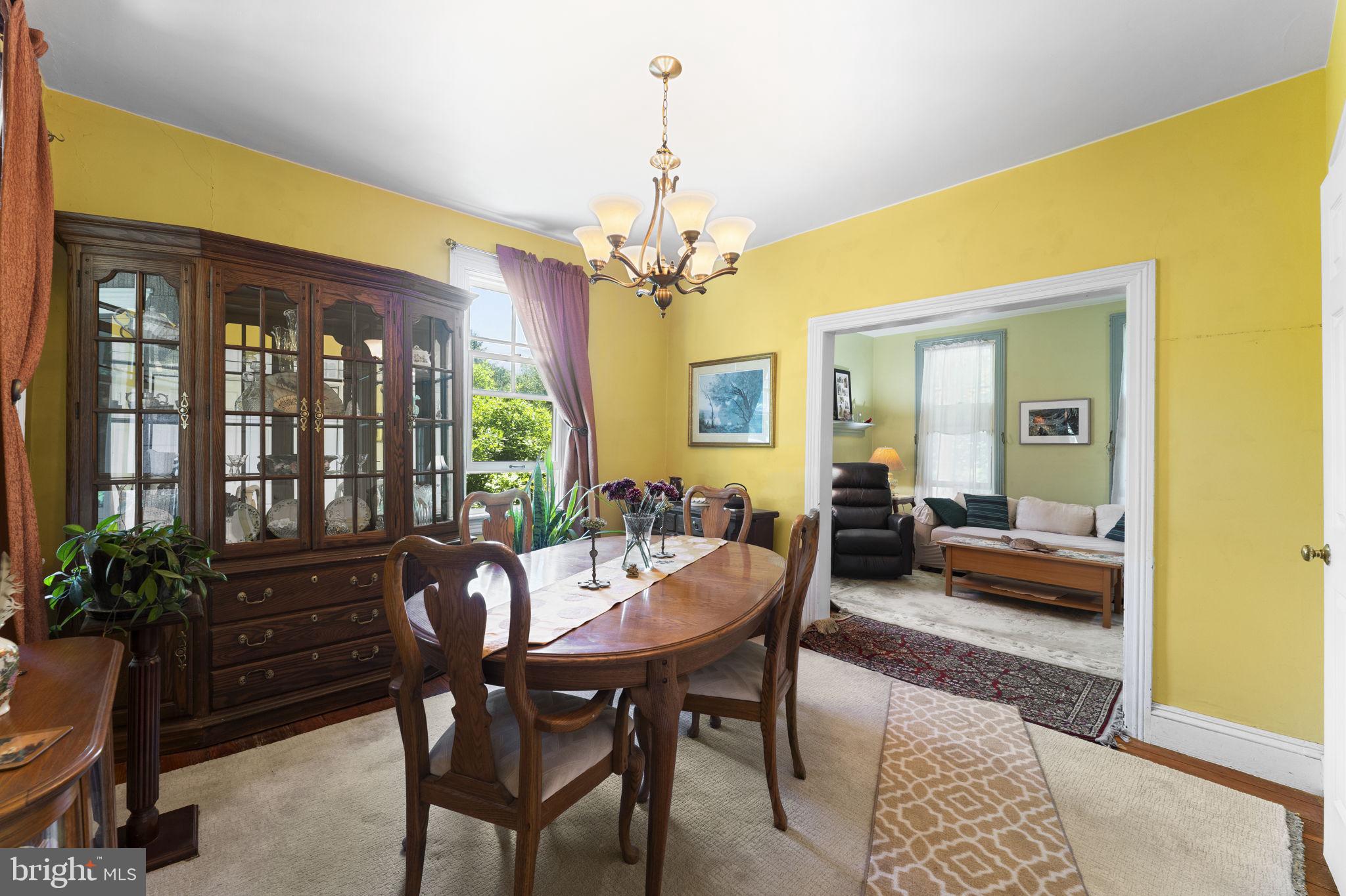 9039 Easton Road Ottsville, PA 18942 - Photo 9 of 61 a view of a dining room with furniture window and wooden floor