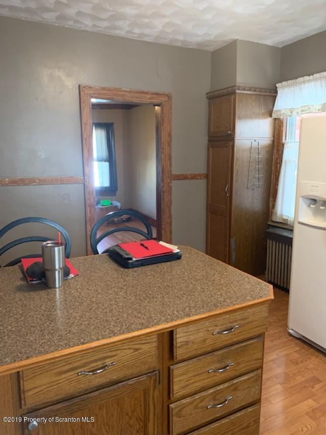 850 Main Street Duryea, PA 18642 - Photo 10 of 24 a kitchen with a refrigerator and countertop