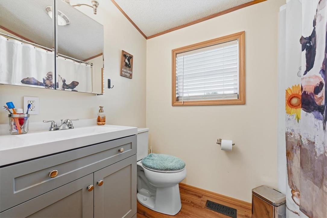 6129 Memorial Road Allentown, PA 18104 - Photo 29 of 46 Natural light and warm wood trim define this functional bathroom space.