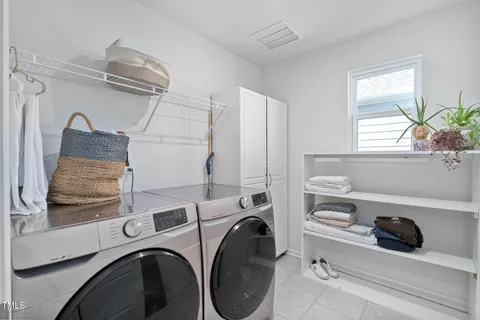 a view of a workspace with furniture and wooden floor
