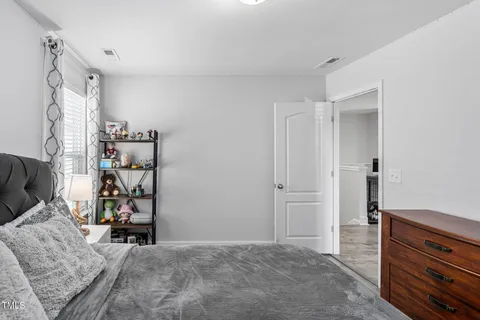 a view of a patio with couches under an umbrella