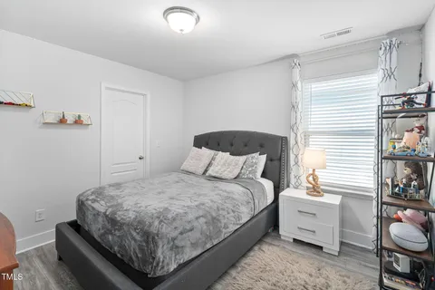 a view of a patio with a table chairs and a umbrella