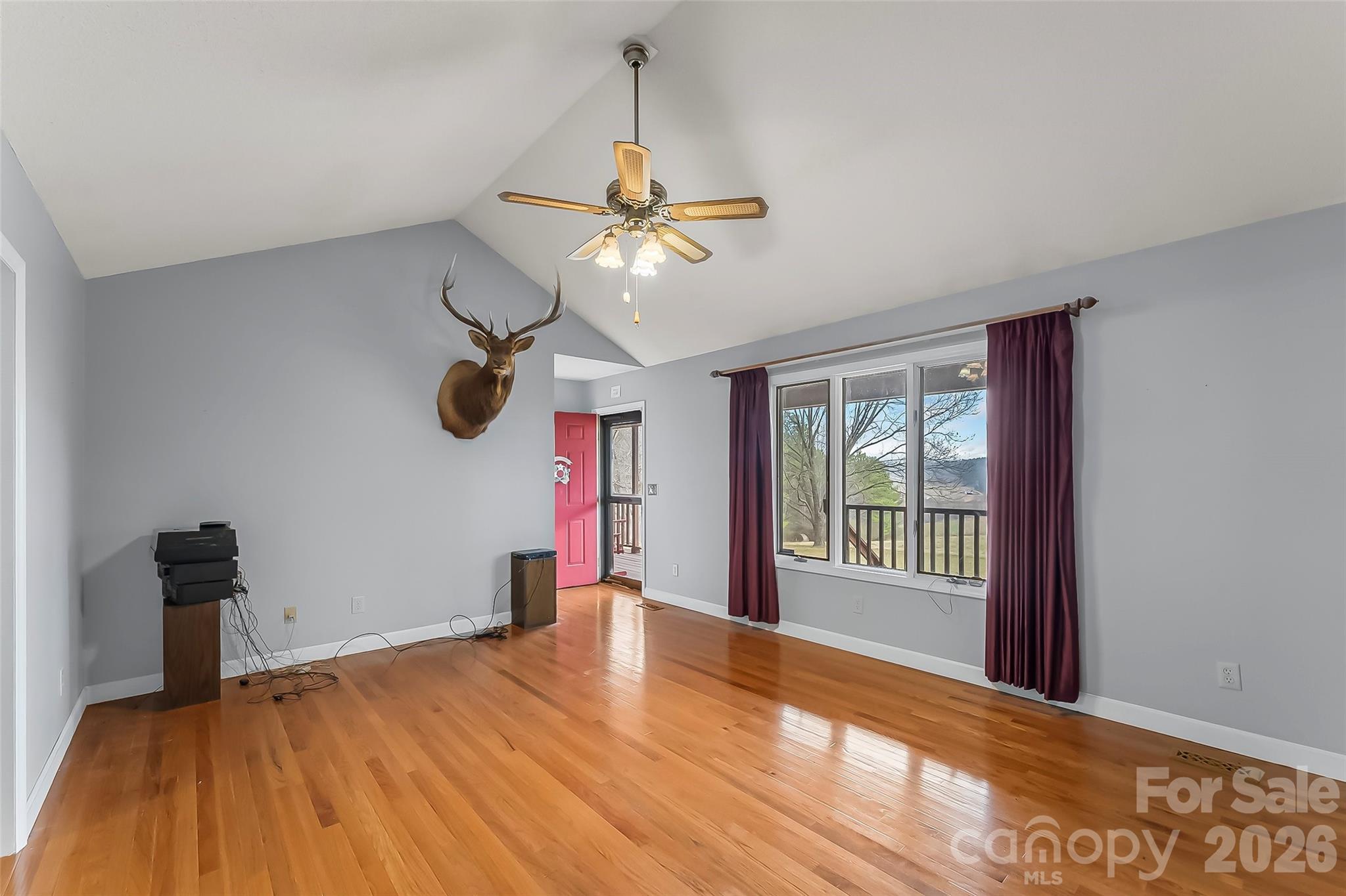 96 Patton Valley Drive Nebo, NC 28761 - Photo 10 of 29 a view of a room with window ceiling fan and wooden floor