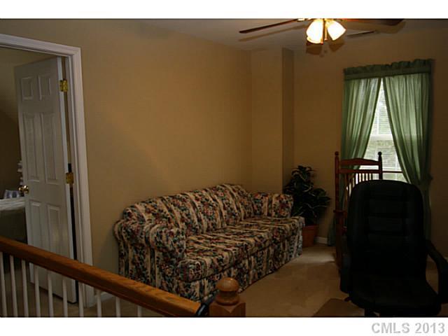 6526 Nevin Road Charlotte, NC 28262 - Photo 12 of 16 a bed sitting in a bedroom next to a window