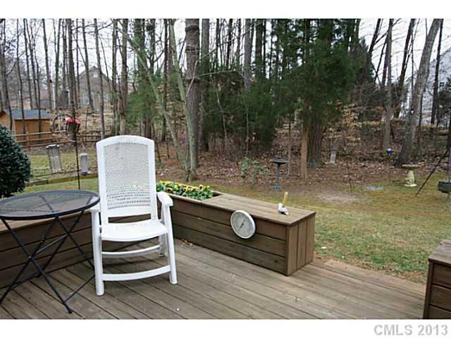 6526 Nevin Road Charlotte, NC 28262 - Photo 15 of 16 a backyard of a house with table and chairs
