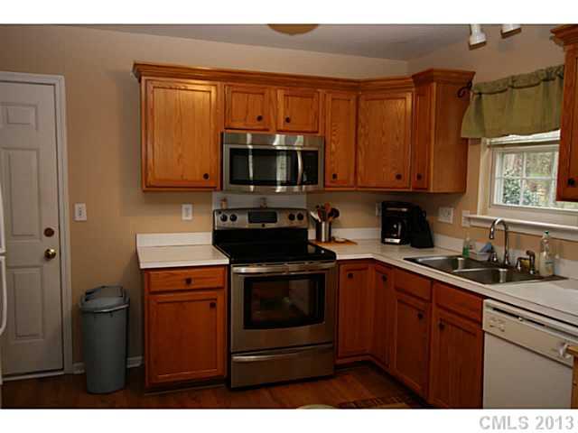 6526 Nevin Road Charlotte, NC 28262 - Photo 4 of 16 a kitchen with a sink and cabinets