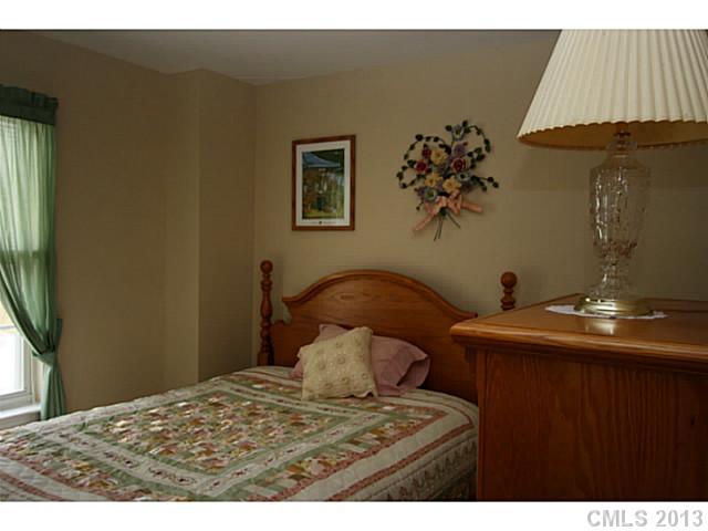 6526 Nevin Road Charlotte, NC 28262 - Photo 9 of 16 a view of a bedroom with a bed