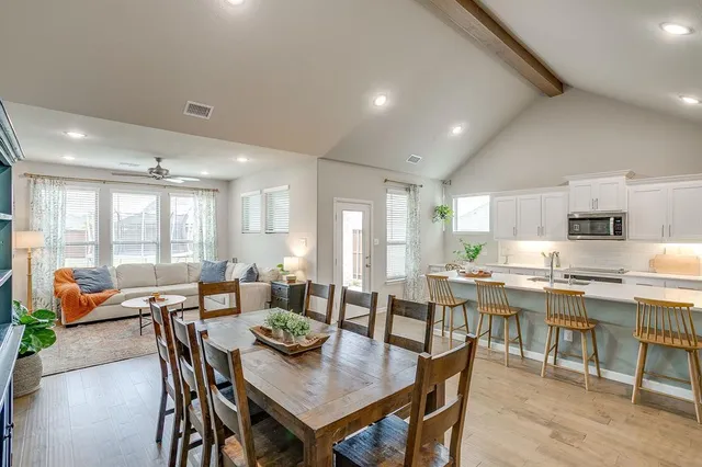 a view of a dining area with furniture and wooden floor