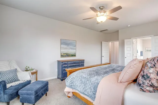 a bathroom with a sink a large mirror and a shower