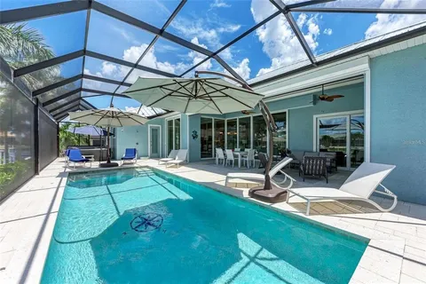 a view of swimming pool with a patio
