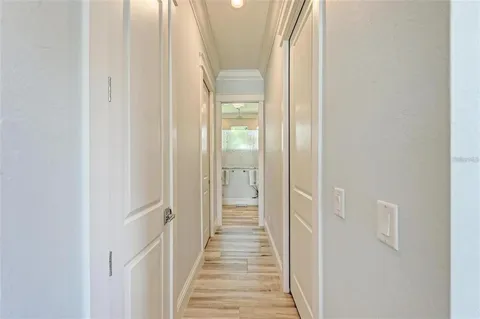 a bedroom with a large bed and a ceiling fan