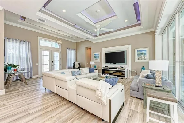 a view of living room with furniture flat screen tv and couches
