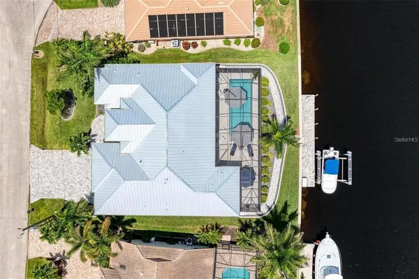 an aerial view of a house with a lake view