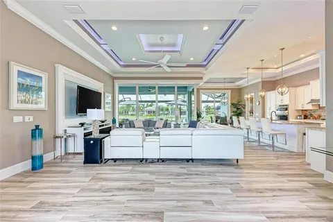 a view of living room kitchen with furniture and flat screen tv