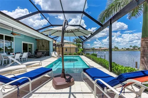 a view of a patio with a table and chairs