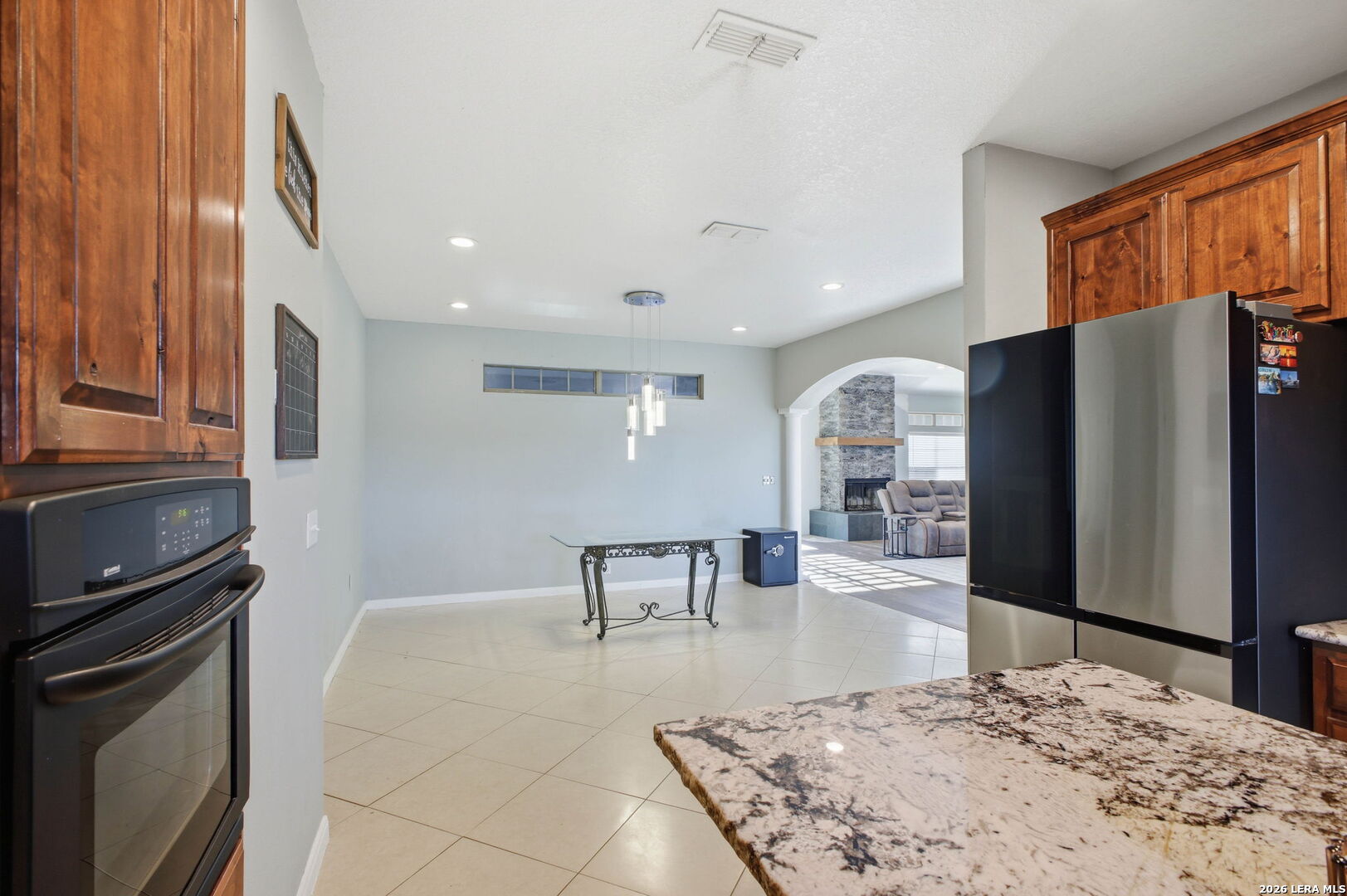 30870 Bridlegate Drive Bulverde, TX 78163 - Photo 15 of 44 a kitchen with stainless steel appliances granite countertop a refrigerator and a stove top oven