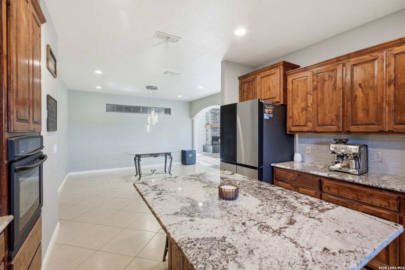 30870 Bridlegate Drive Bulverde, TX 78163 - Photo 16 of 44 a kitchen with stainless steel appliances granite countertop a sink refrigerator and cabinets