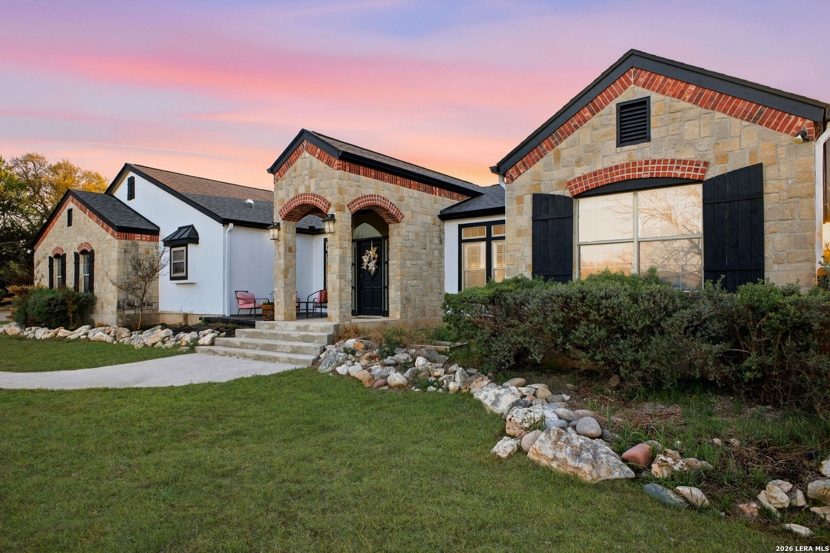30870 Bridlegate Drive Bulverde, TX 78163 - Photo 3 of 44 a front view of a house with a garden