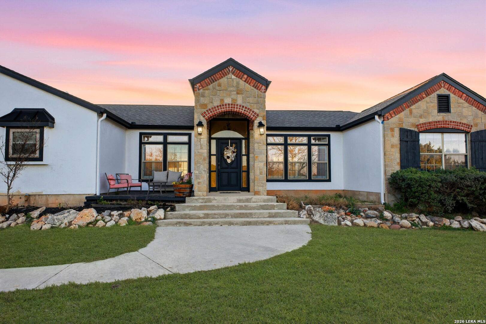 30870 Bridlegate Drive Bulverde, TX 78163 - Photo 4 of 44 a front view of a house with a garden and yard