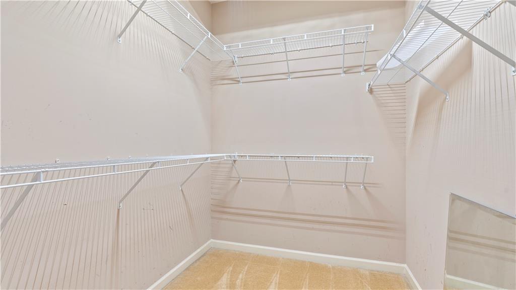 91 Medallion Park Newnan, GA 30265 - Photo 18 of 45 a view of walk in closet with empty racks