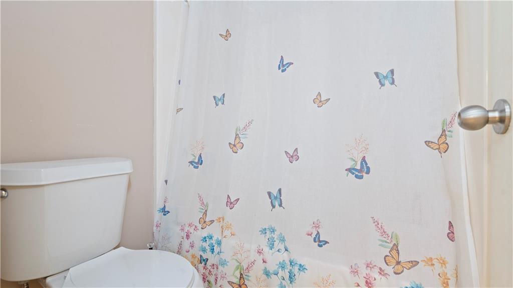 91 Medallion Park Newnan, GA 30265 - Photo 25 of 45 a white toilet sitting next to a bathroom sink