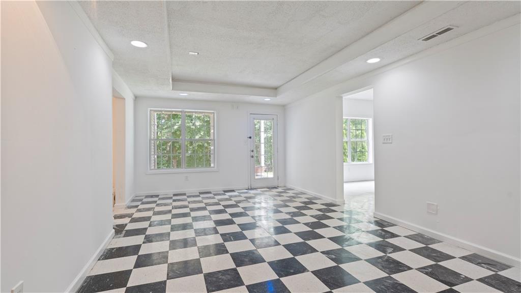 91 Medallion Park Newnan, GA 30265 - Photo 29 of 45 a view of a big room with windows and mountain view