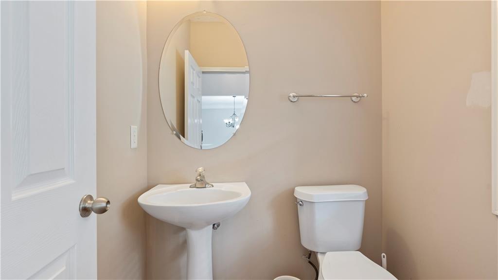 91 Medallion Park Newnan, GA 30265 - Photo 6 of 45 a bathroom with a toilet sink and mirror