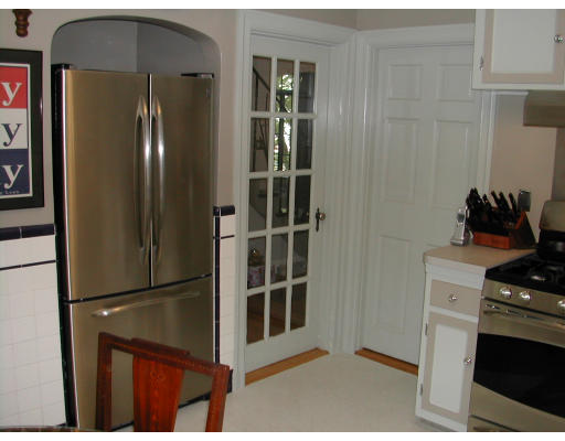 40 Avondale Road Newton, MA 02459 - Photo 9 of 17 a kitchen with stainless steel appliances granite countertop a refrigerator and a stove